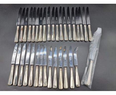 A set of eleven silver handled Hanoverian pattern table knives and thirteen side knives, by United Cutlers, Sheffield 1998 an