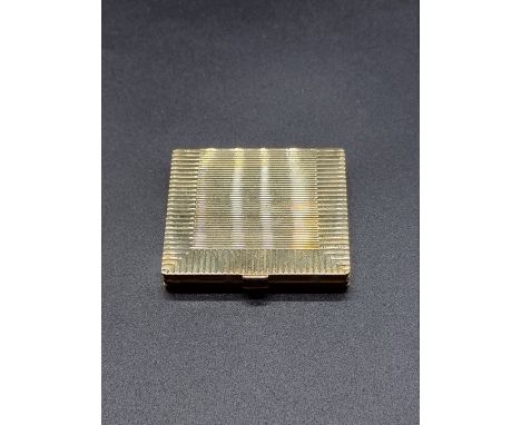 A rare Cartier 18ct gold engine turned four fold collapsible travelling photograph frame, set rectangular cabochon sapphires 