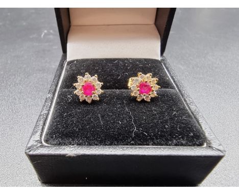 A pair of 18ct gold ruby and diamond ear studs, gross weight 2.1g 