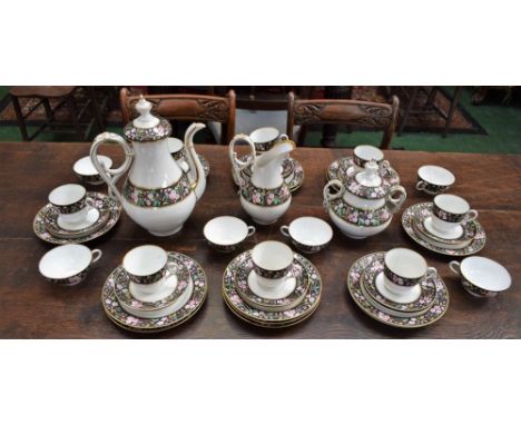 A Bavarian porcelain part breakfast service, banded with pink blossom on matte black ground, comprising coffee pot, sucrier, 