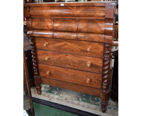A Victorian flame mahogany Scotch chest, hipped rectangular top above one long and three short serpentine drawers, the base w