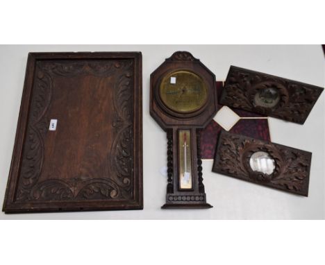 A carved oak wall barometer, John Barker &amp; Co, Kensington, 55cm high; a pair of rectangular oak frames, carved with acorn