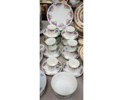 A Royal Albert part tea service, painted with Violets and foliage, green band, comprising cups, saucers, side plates, slop bo