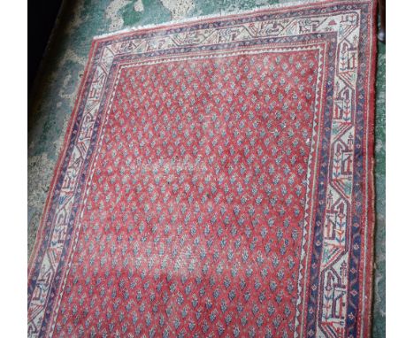 A Middle Eastern hand knotted carpet, 233cm x 127cm