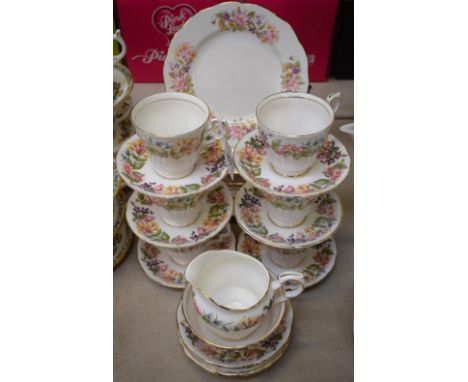 A Paragon Country Lane pattern part tea service, comprising six teacups, saucers and tea plates, bread and butter plates, mil