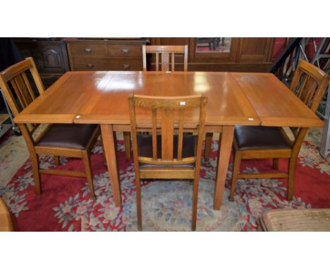 A 20th century light oak drawer-leaf dining table; a set of four conforming dining chairs (5)