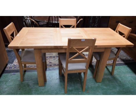 A contemporary light oak extending dining table, extends to 164.5cm; a set of four conforming dining chairs (5)