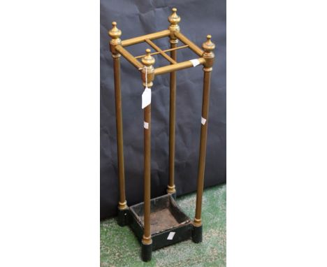 A cast iron and brass walking stick stand, urnular finials, 62.5cm high