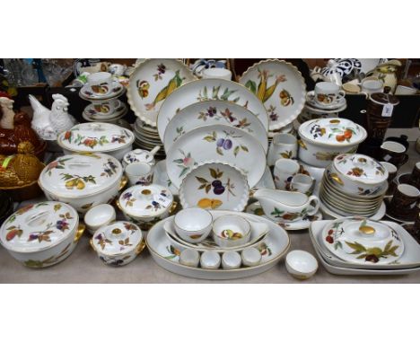 A Royal Worcester Evesham pattern dinner service, including lidded tureens, casserole dishes, a graduated set of three meat p