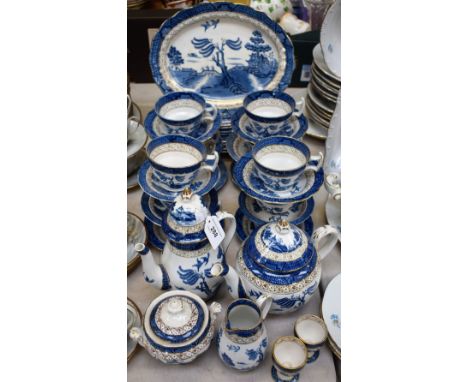 A Booths Real Old Willow pattern matched tea and coffee service, including cups, saucers, coffee pot, tea pot, side plates, e