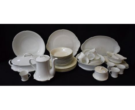 A Limoges plain white porcelain dinner service for twelve comprising dinner plates, salad plates, dessert bowls, sauce boat, 