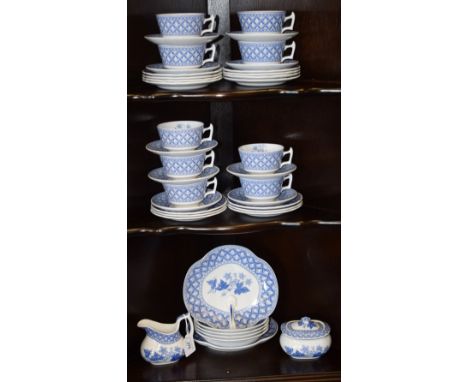 A Spode Geranium pattern six setting part tea service, transfer printed in blue and white, comprising cups, saucers, side pla