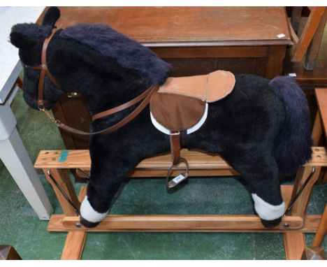 A Mulholland and Bailey rocking horse, stuffed cloth horse on pine base 