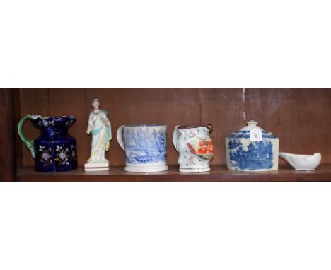 A pearlware commode shaped tea caddy, c1820; an Ironstone jug; a Satyr head jug; a blue and white mug; a Creamware pap boat; 