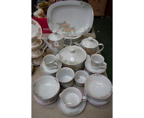 A Denby Pottery Portugal pattern dinner and tea service including teapot, cups, saucers, dinner and side plates, tureen, meat