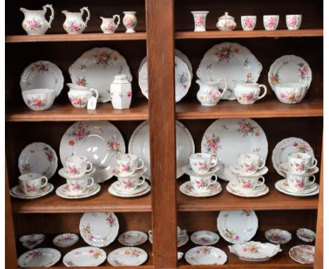 A Royal Crown Derby Posies pattern part tea service, comprising cups, saucers, side plates, milk jug, sugar bowl, bread and b