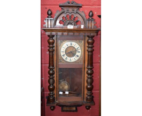 A mahogany cased Vienna type wall clock, Roman numerals, turned supports 