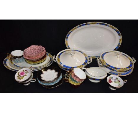 A W H Grindley Art Deco part dinner set, including a pair of lidded tureens, oval meat platters, etc; a set of six Royal Stua