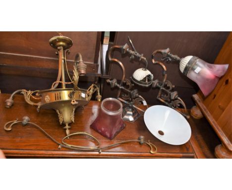 Lighting - a 20th century brass three arm ceiling light; a pair of later coppered wall sconces (3)