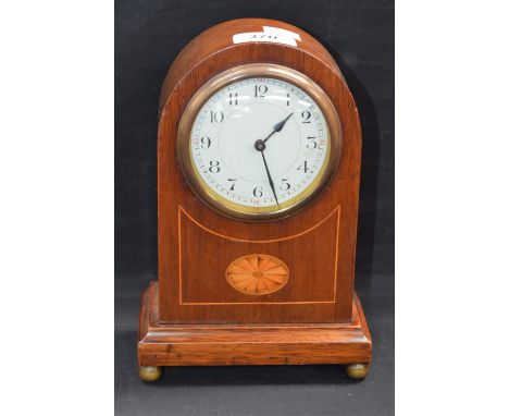 An Edwardian mahogany bullet shaped mantel clock, inlaid with an oval batwing patera, 22cm high