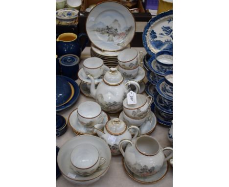 A Japanese eggshell porcelain Export Ware tea set, comprising cups, saucers, plates, teapot, sugar bowl, etc