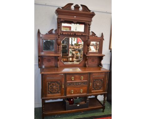 A 20th century composed mirror-back side cabinet, the mahogany superstructure formed from a salon side cabinet with a broken 