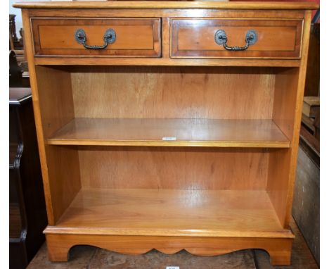 A reproduction yew hall table, crossbanded top above a pair of short drawers and a shelf, bracket feet, 76cm high