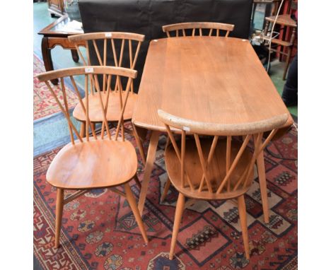 An Ercol light elm elliptical dropleaf dining table; a set of four conforming dining chairs (5)