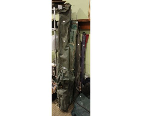 A large selection of fishing rods and holdalls Additional informational: lot includes - Shimano Aero Match 390, Shakespeare, 