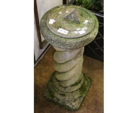 A metal sundial on cast stand
