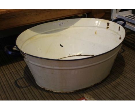A vintage enamel twin handled large wash bowl