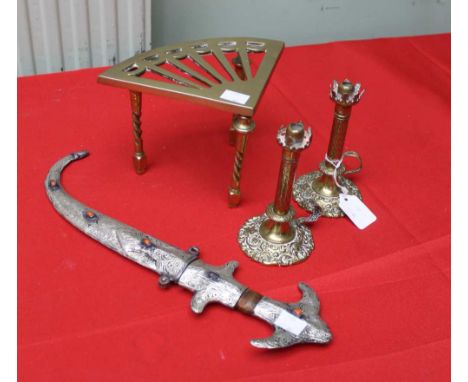 A Middle Eastern white metal handled dagger in white metal covered scabbard, together with a pair of decorative brass chamber