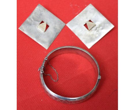 A pair of silver designer earrings of square form with mesh triangles to the centres, together with a decoratively engraved s