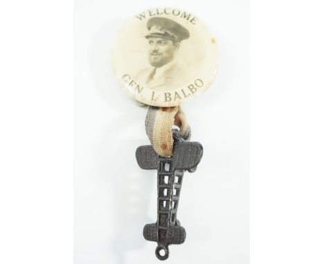 A 1930s aviation pin badge comprising a button badge bearing a photographic portrait and legend "Welcome Gen I Balbo" with br