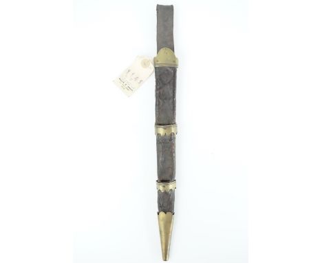 An 18th Century Scottish dirk scabbard, of black hide bearing tooled decoration, the brass locket, chape and bands having cus