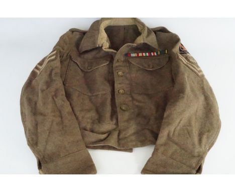 A 1940 Pattern Battledress Blouse bearing 7th Armoured Division Royal Signals insignia 