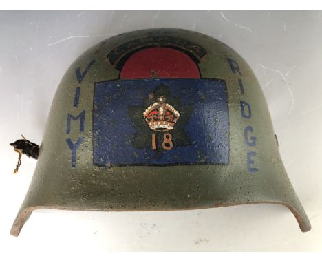 An Imperial German helmet armoured brow plate or Stirnpanzer, bearing painted Canadian commemorative decoration, the interior