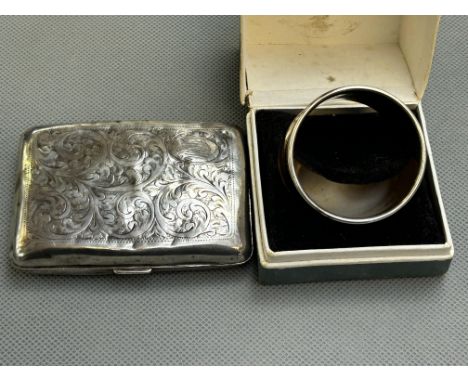 Silver cigarette case bruised together with a silver napkin ring 