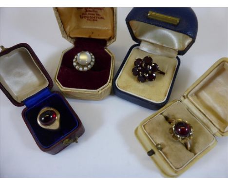 4 COSTUME RINGS, 2 CABOCHON GARNETS, A GARNET 'DAISY PETAL' RING AND A CABOCHON MOONSTONE AND PEARL, ALL ON 9CT GOLD BANDS