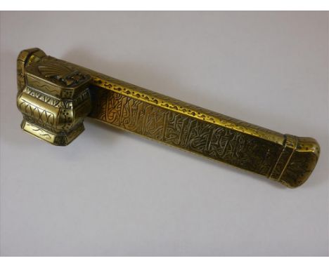 A PERSIAN BRASS SCRIBES PEN BOX OF RECTANGULAR FORM , HINGED LID AND ATTACHED INK WELL, PROFUSE DECORATION AND SCALLOP LID TO