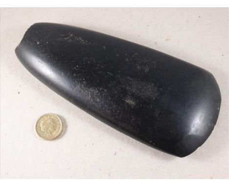 NEOLITHIC POLISHED BLACK STONE AXE HEAD OF ROUNDED OBLONG FORM, APPROX. 18 cm