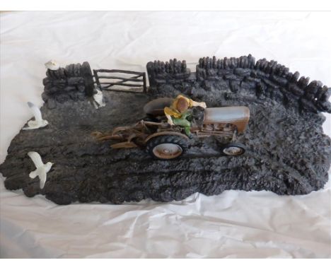 FIGURE GROUP DEPICTING TRACTOR PLOUGHING POSSIBLY COUNTRY ARTISTS