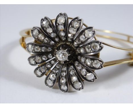 VERY IMPRESSIVE LATE VICTORIAN YELLOW METAL DIAMOND SET STAR BANGLE, THE REMOVABLE STAR HAVING 14 RAYS EACH SET WITH 4 ROSE C