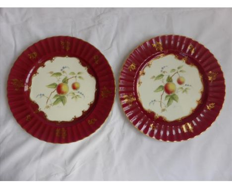 2 ROYAL WORCESTER CABINET PLATES DEPICTING FRUIT WITHIN A RED BORDER, SIGNED H.PRICE APPROX. 27 cm DIA.