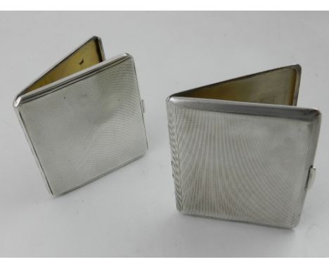 Two silver cigarette cases, both with engine turned exterior and gilt washed interior, stamped Birmingham 1936 and 1946. Appr