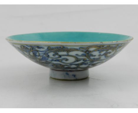 A Chinese blue and white trinket dish, glazed with turquoise to interior, bears blue seal mark to base. D: 10cm