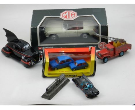 A Corgi 1:18 sale collector's model of an MGB car, boxed, together with a boxed pair of Austin Metro vehicles, two Batmobiles