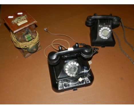 A GPO 200 series telephone mounted to an exchange system and incorporating a drawer, together with a GPO 300 series telephone