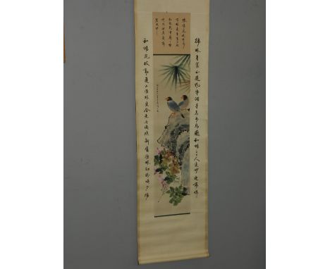 A Chinese scroll, printed with birds, flowers and foliage, bears Chinese verse.