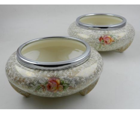 A. J. Wilkinson Ltd, England. Two Art Deco cream ground flower bowls, decorated in the Celtic Rose pattern, raised on three l